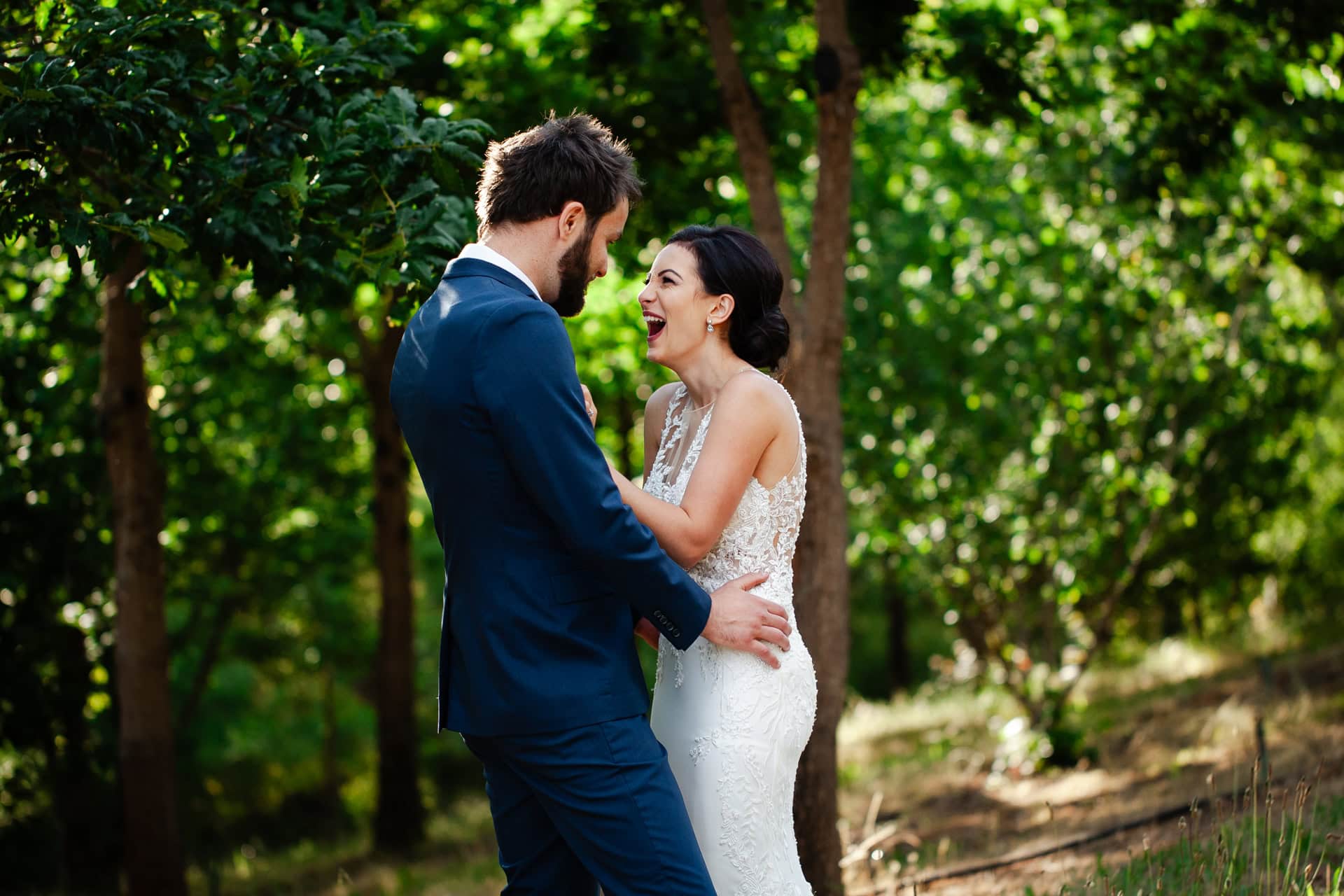 groom and bride hugging laughing in Perth