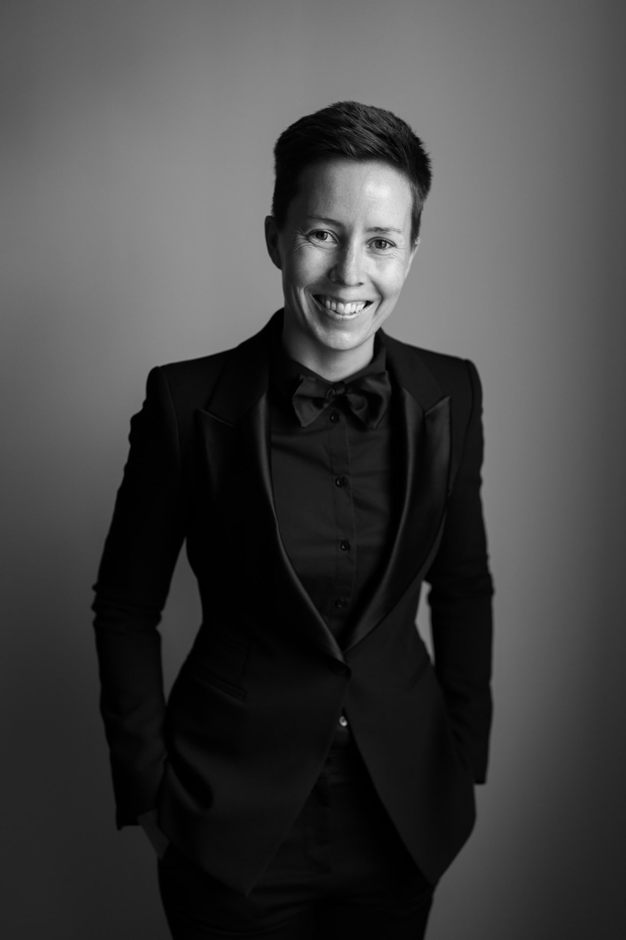 perth wedding photographer sara hannagan wearing black suit with black bow tie smiling