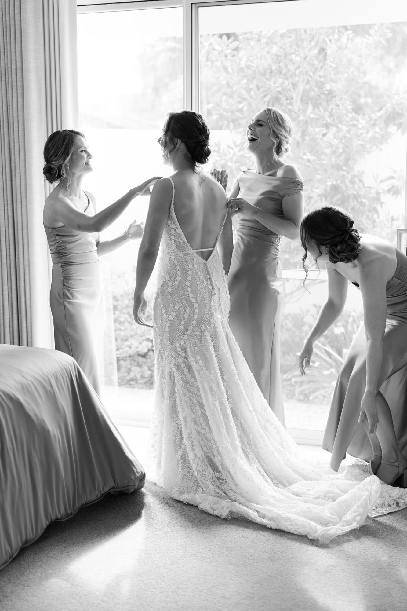 wedding photos Perth bride getting dressed with bridesmaids