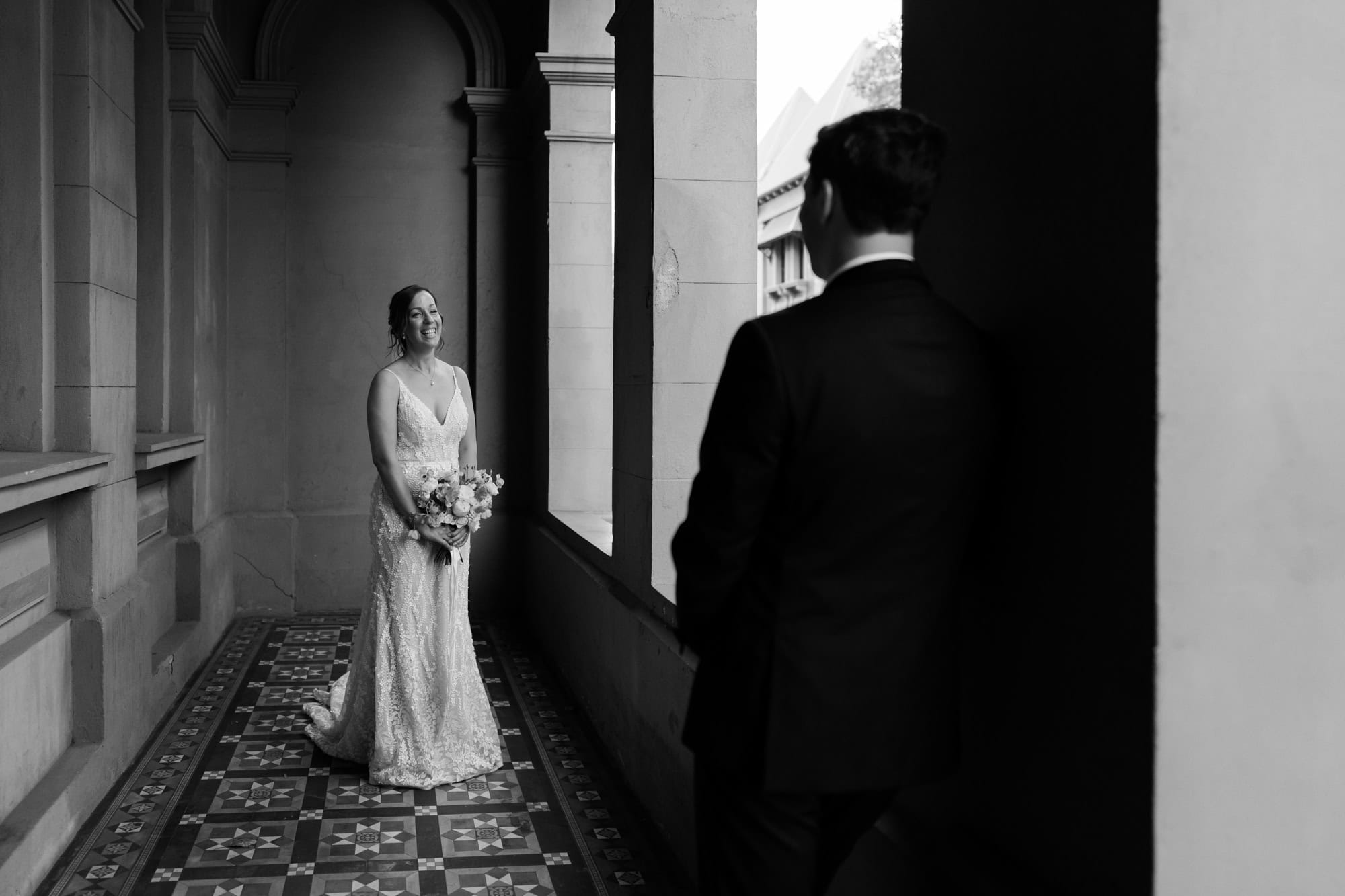 wedding photos perth bride holding bouquet looking at groom