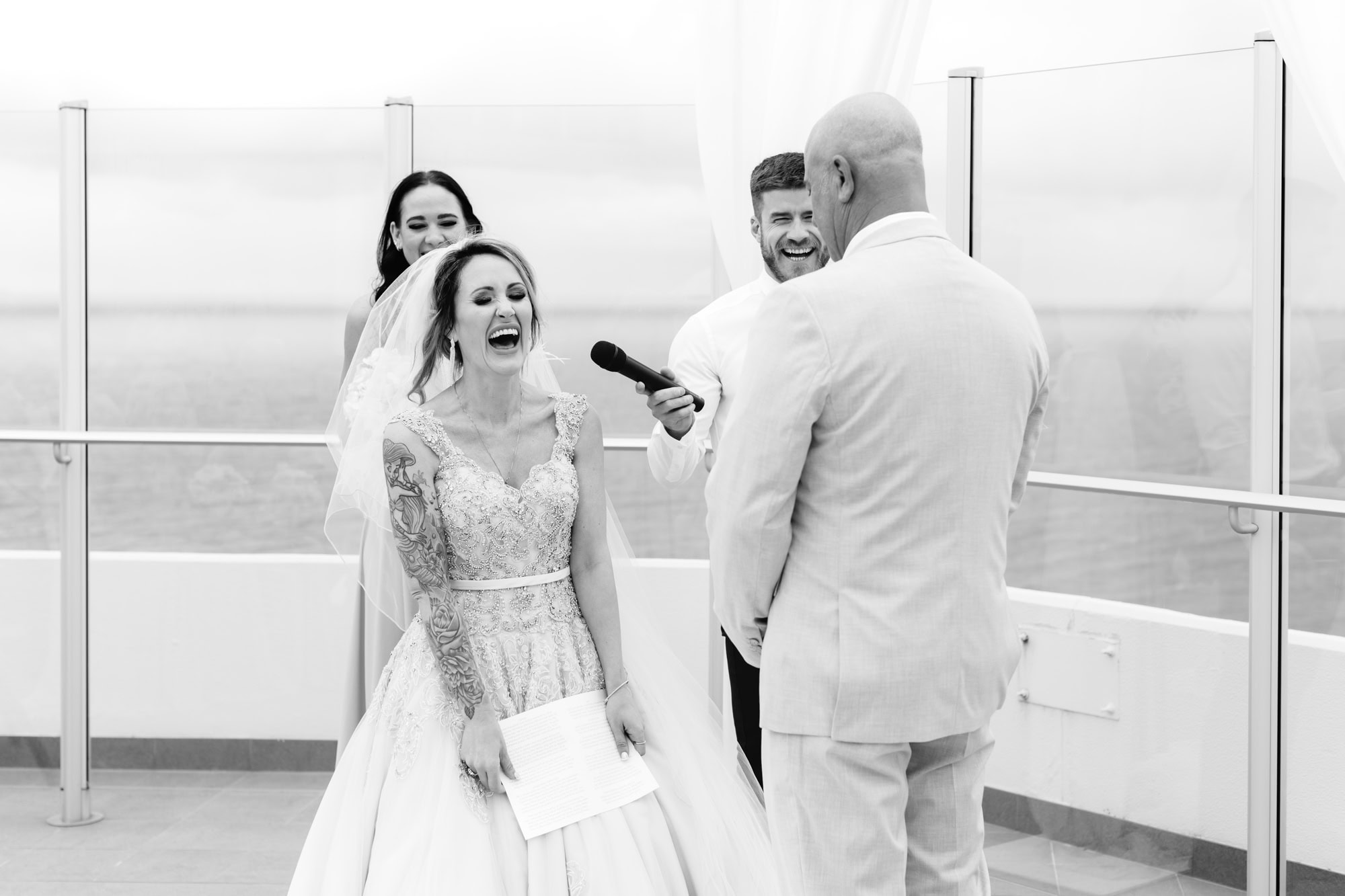 wedding photos Perth bride with tattoo sleeve laughing at wedding ceremony