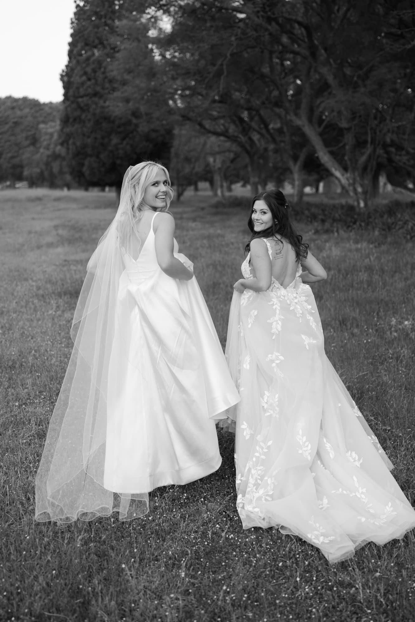 wedding photos Perth two brides wearing white dresses walking away