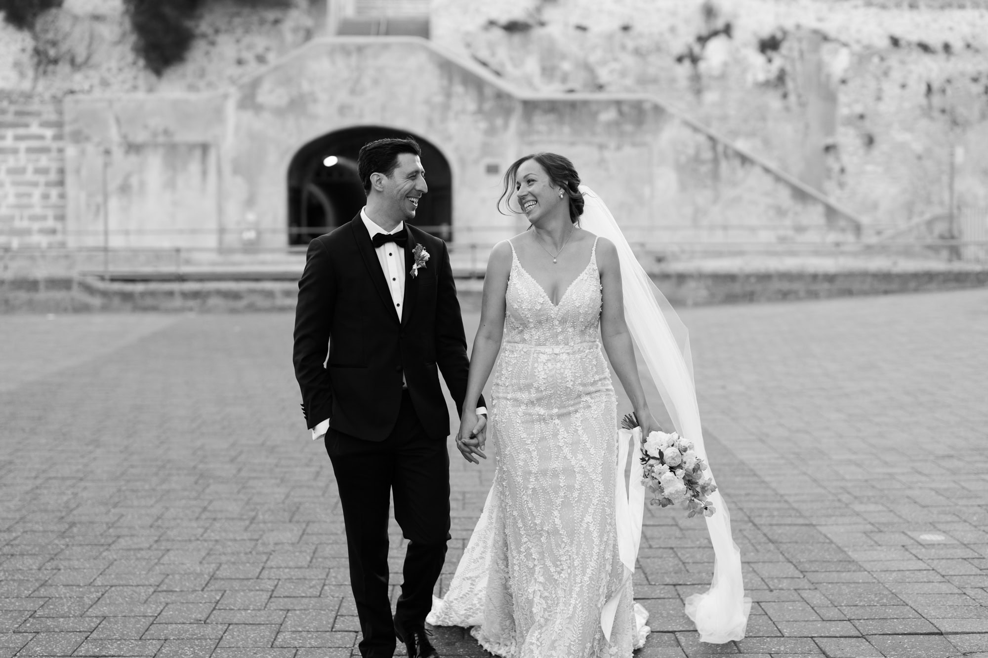 wedding photos Perth bride and groom walking down street holding hands