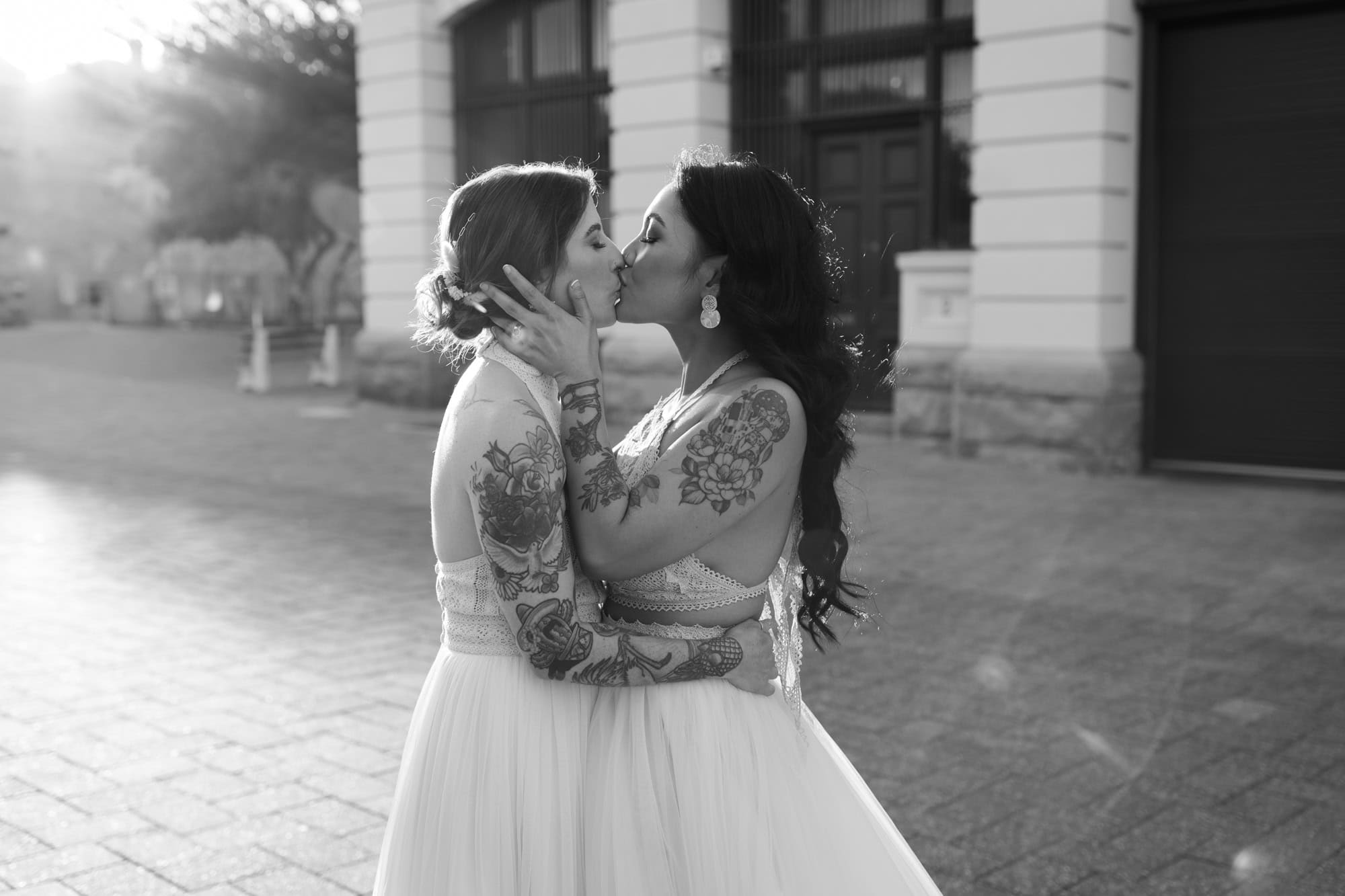 wedding photos Perth two brides with tattoos on arms kissing