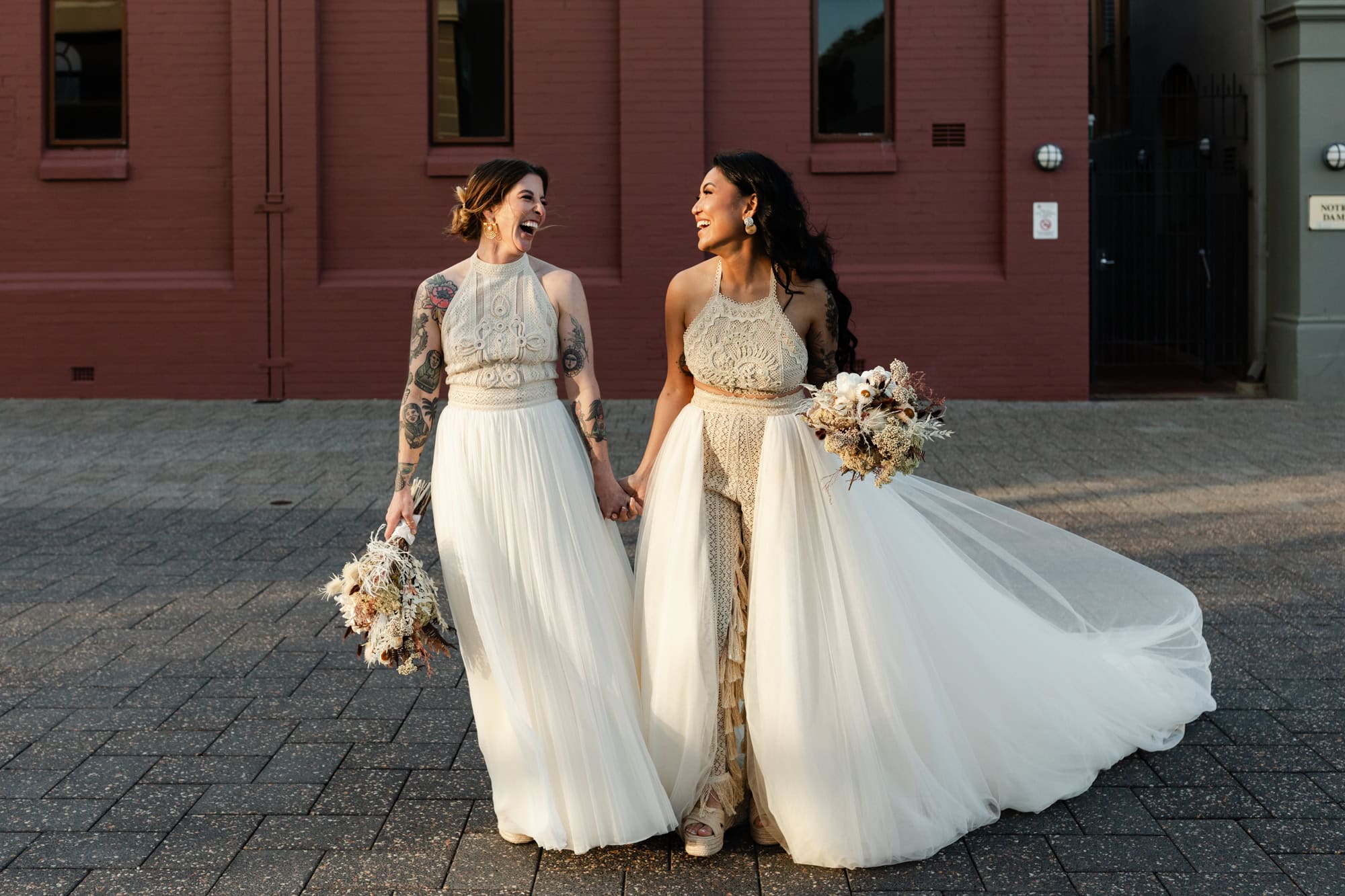 wedding photos Perth two brides with tattoos holding hands walking