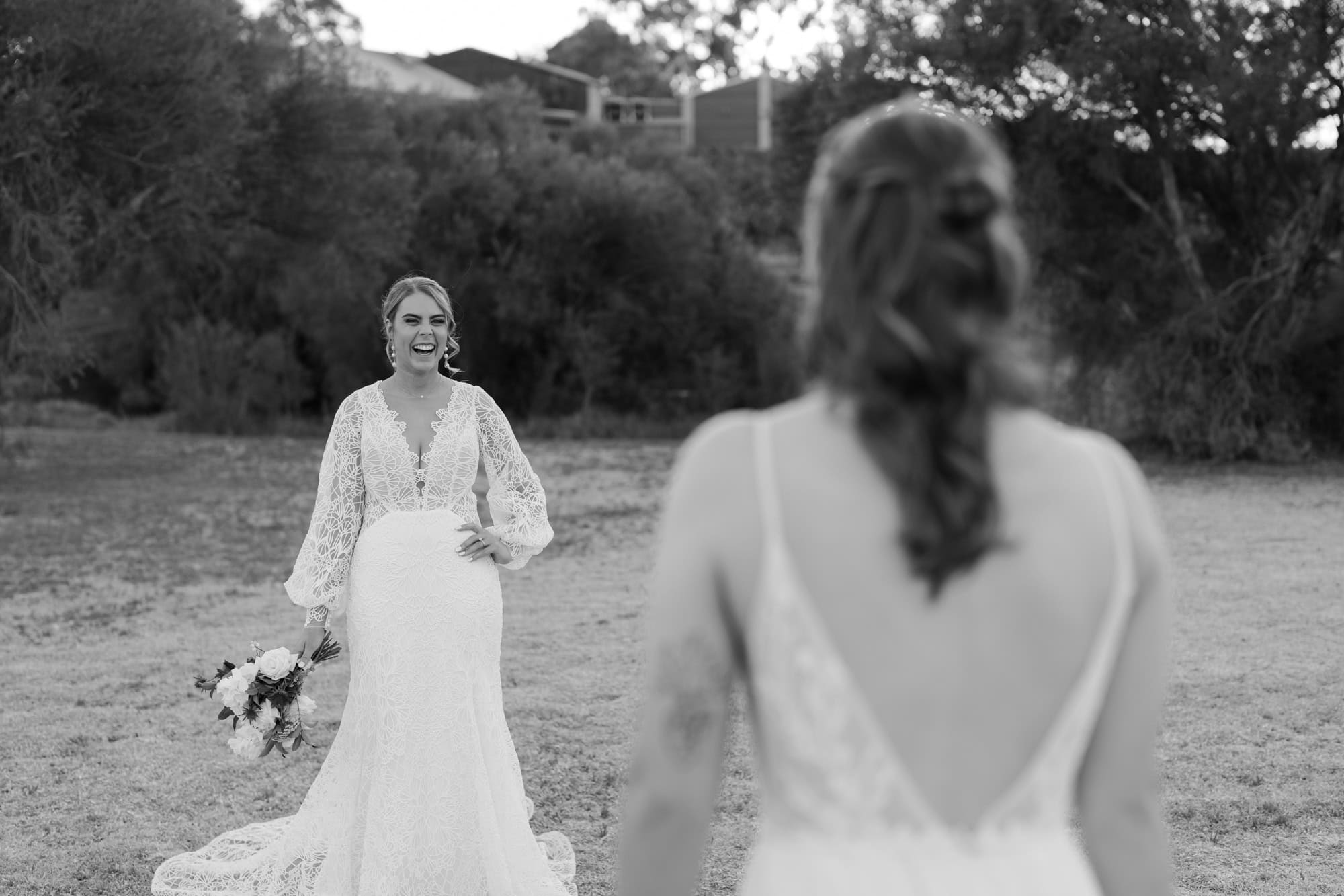 wedding photos Perth bride wearing white dress laughing looking at bride